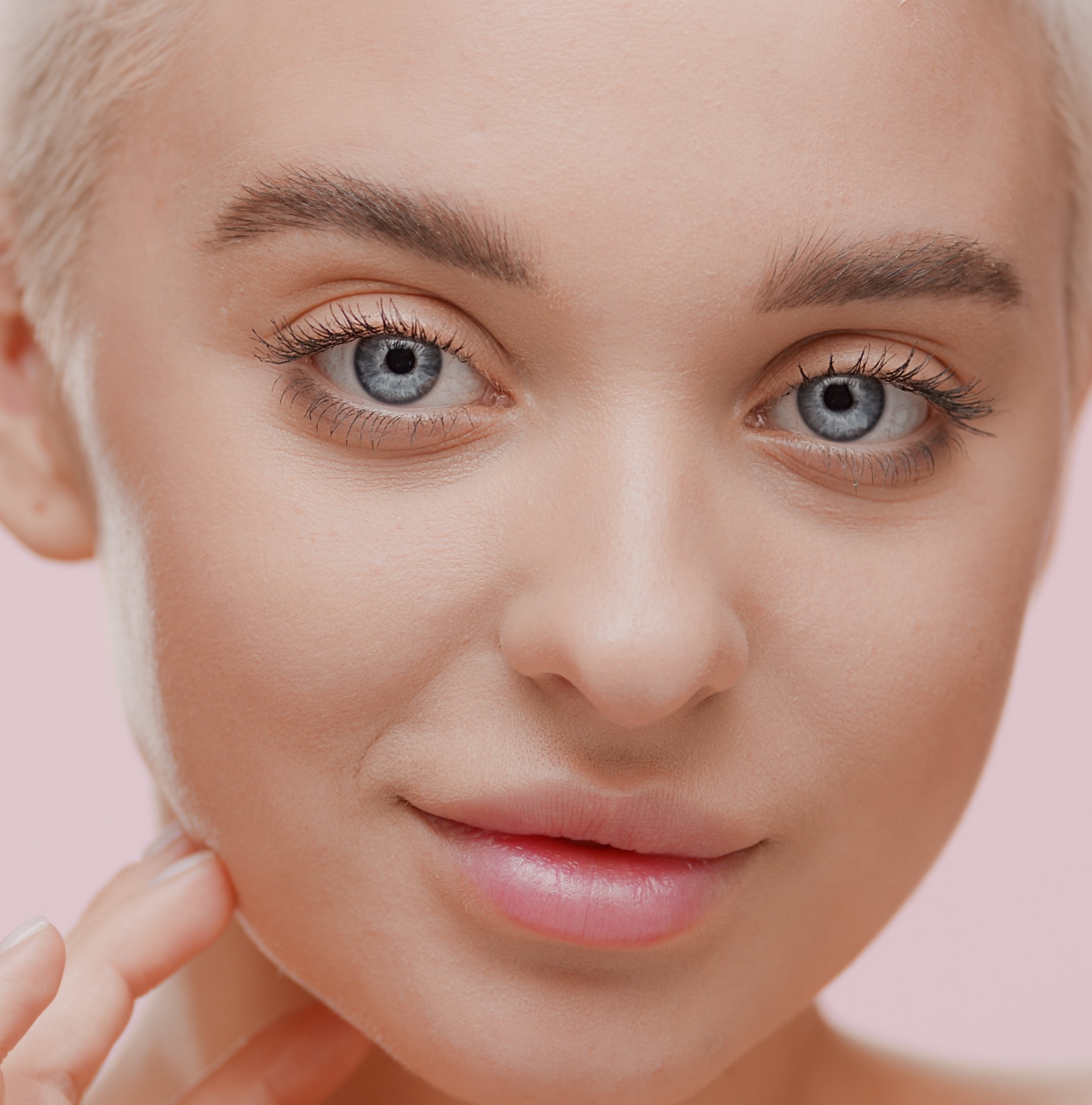 Good-looking,Young,Slim,Caucasian,Woman,With,Light,Hair,Touches,Her